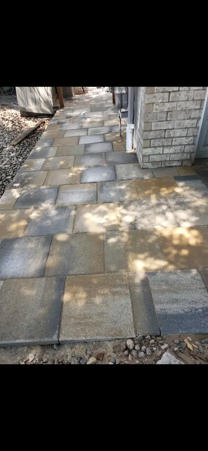 Completed paver walkway along house