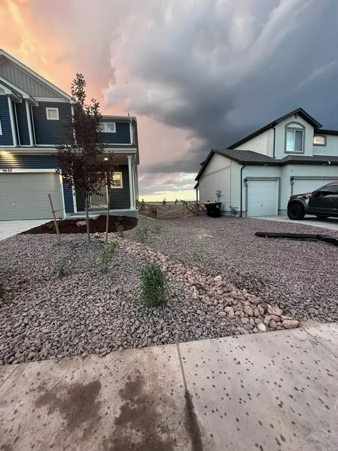 Front yard rock landscaping at sunset