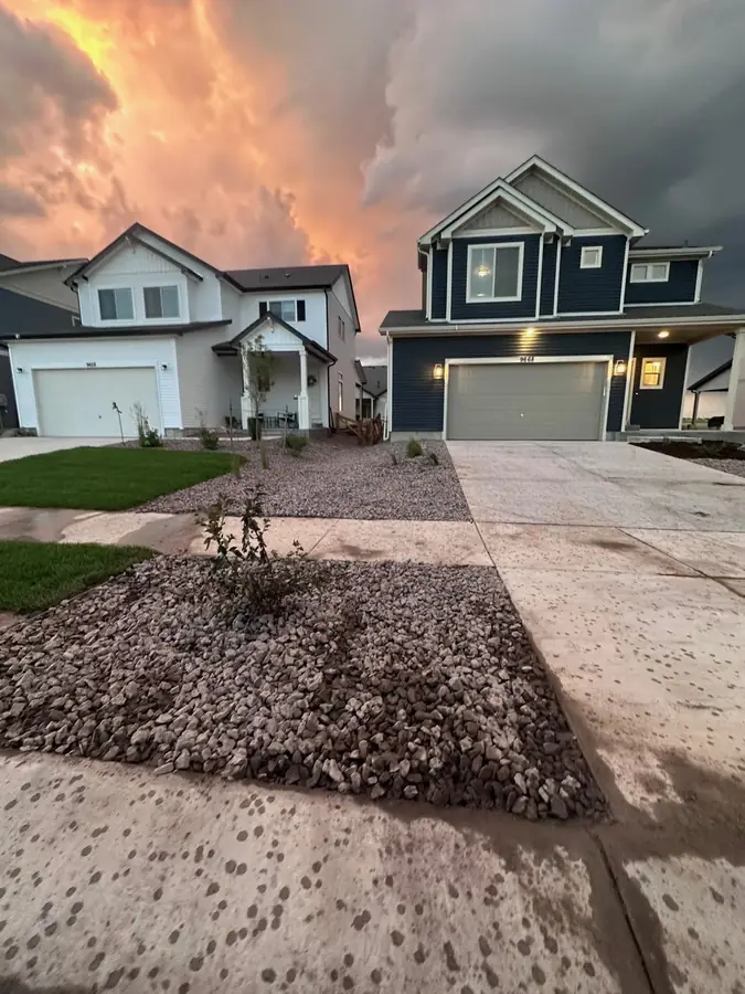 Residential rock and gravel front yard xeriscape at dusk
